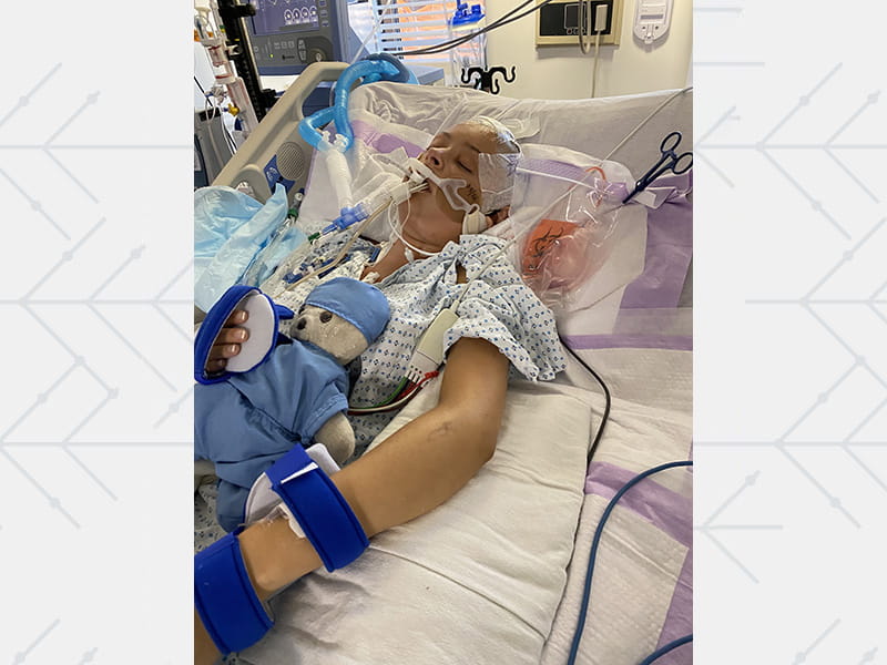 Jennifer Rose Goldman in intensive care, on a ventilator and trach tube to breathe and a feeding tube for nourishment