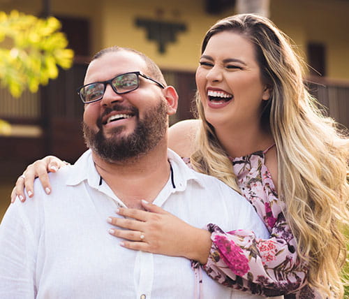 Embracing couple laughing